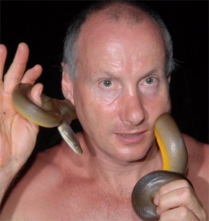 the snake man with a snake